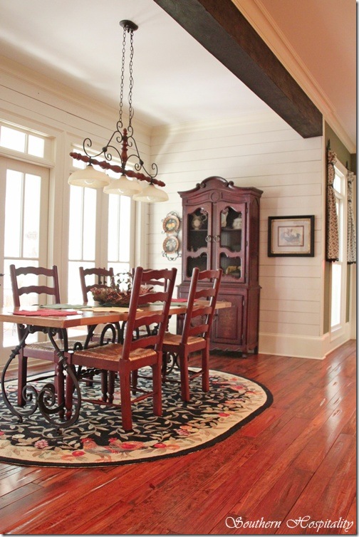 breakfast room with plank walls