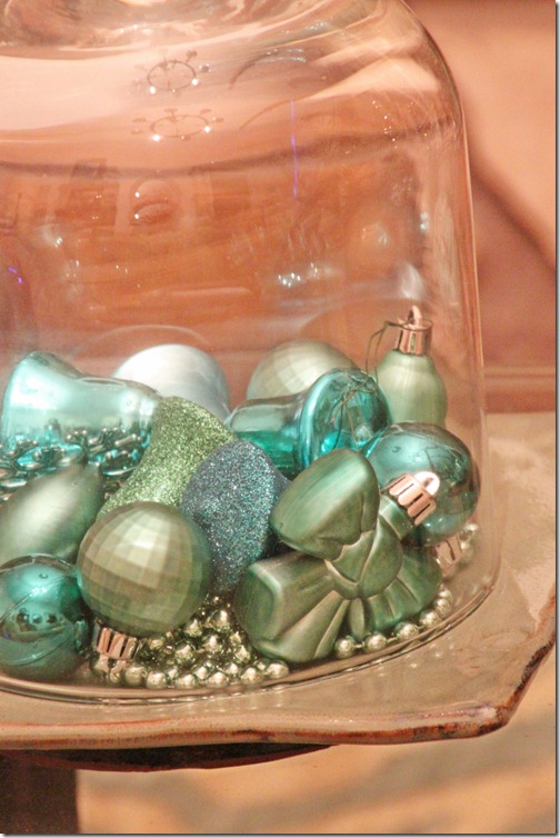 turquoise ornaments under glass