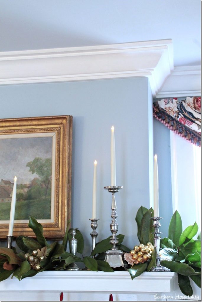 candles and greens on mantel