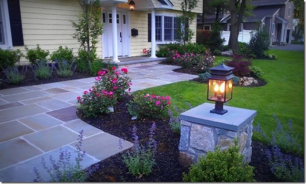 stone driveway and pillar with lighting