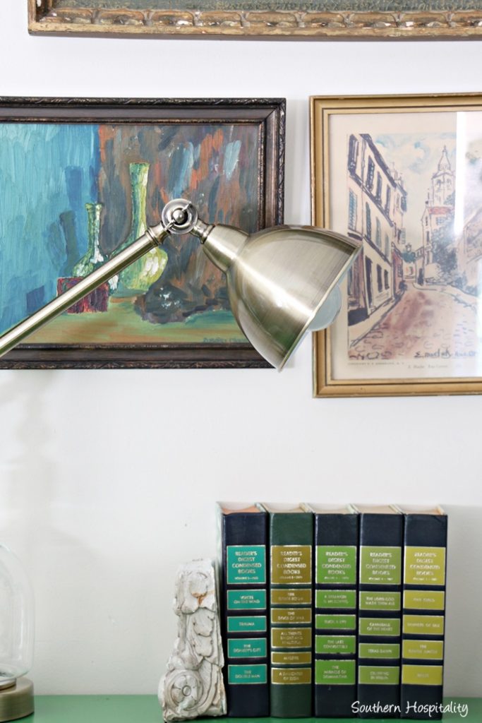brass lamp on green table