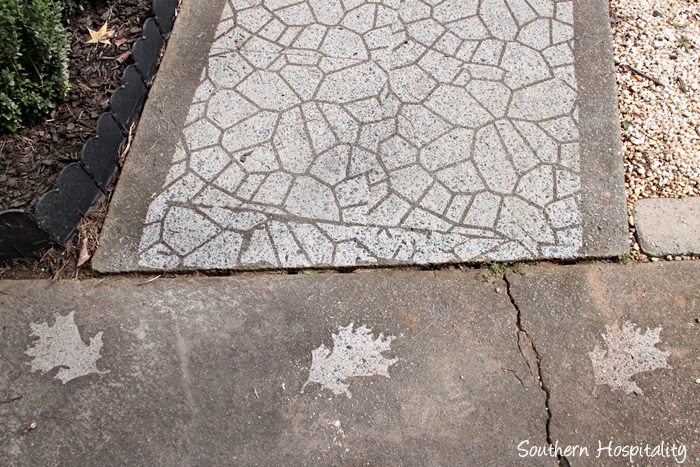 sidewalk with cobblestone and leaf