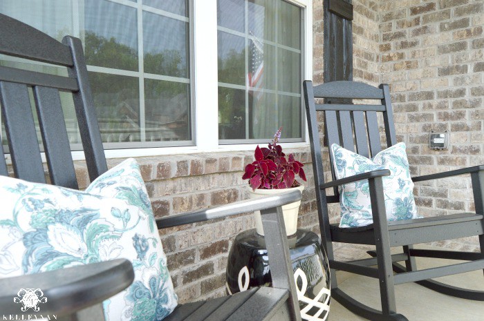 Black-rocking-chairs-on-Brick-front-porch-summer-tour