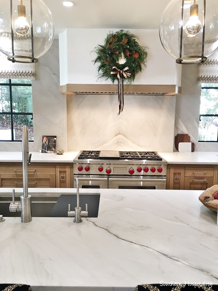 Elegant kitchen with Christmas wreath decoration on range hood in Atlanta showhouse 2016