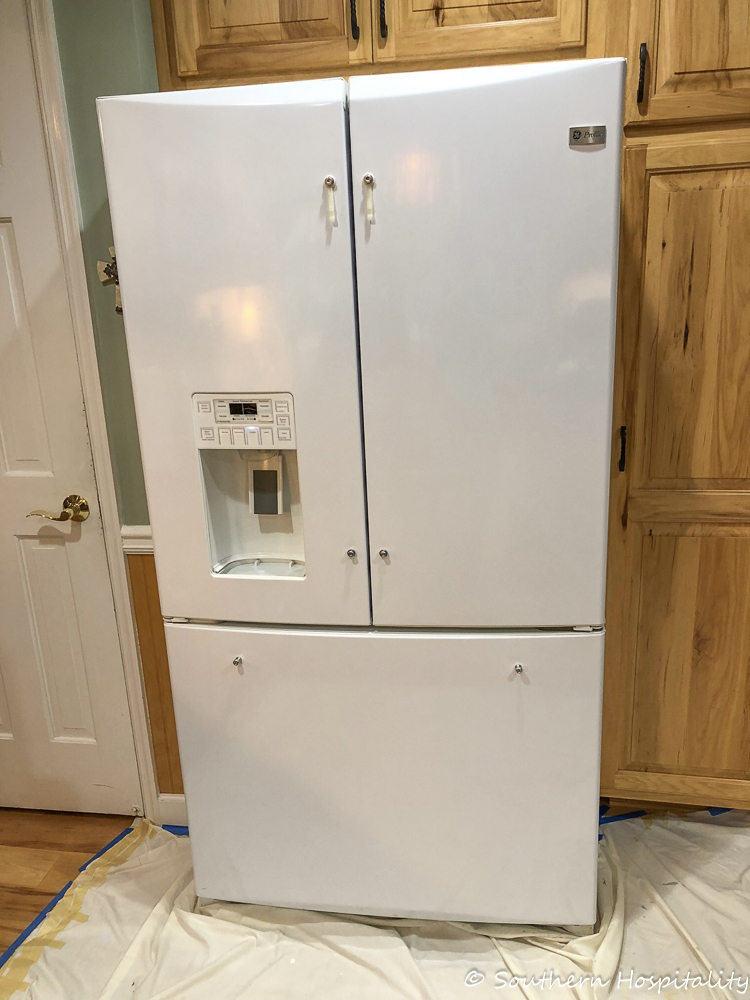 Old white store refrigerator